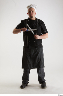 Clifford Doyle Chef Sharpening Knife pose with knife standing whole…